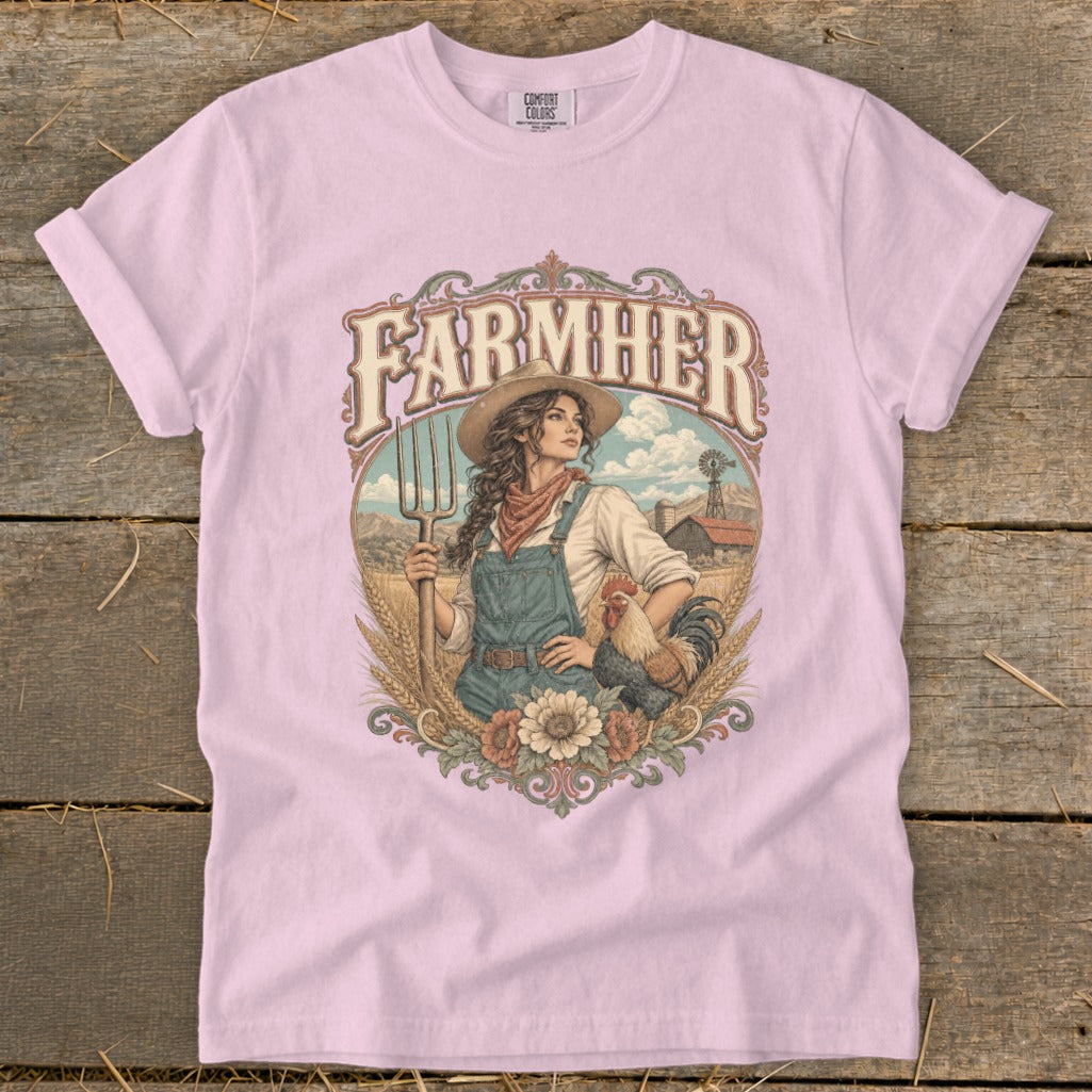 Farmer graphic on pink t-shirt with woman holding pitchfork and rooster.