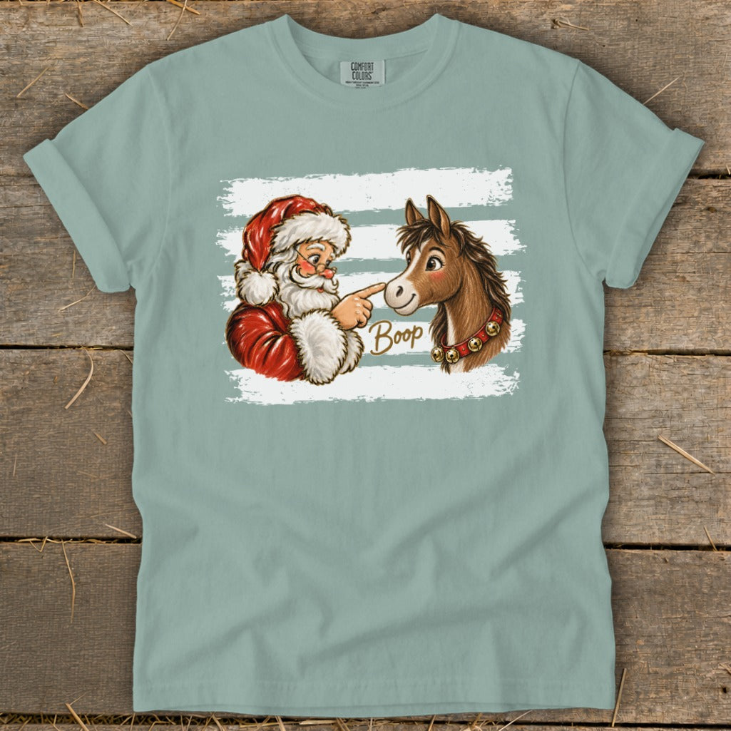Santa boops a horse's nose with the word "Boop" in cursive.
