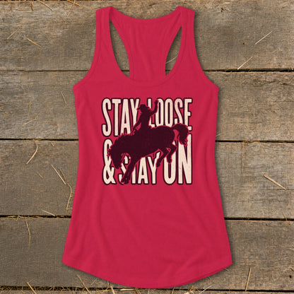 Pink tank top with "Stay Loose & Stay On" text and bucking bronco silhouette.