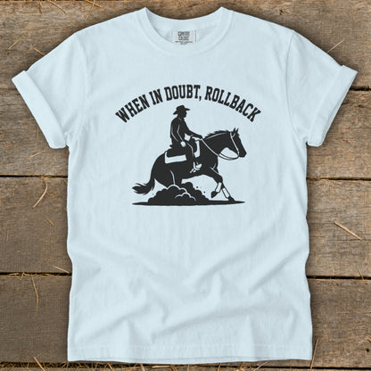 White t-shirt with graphic "When in doubt, rollback" and cowboy on horse.