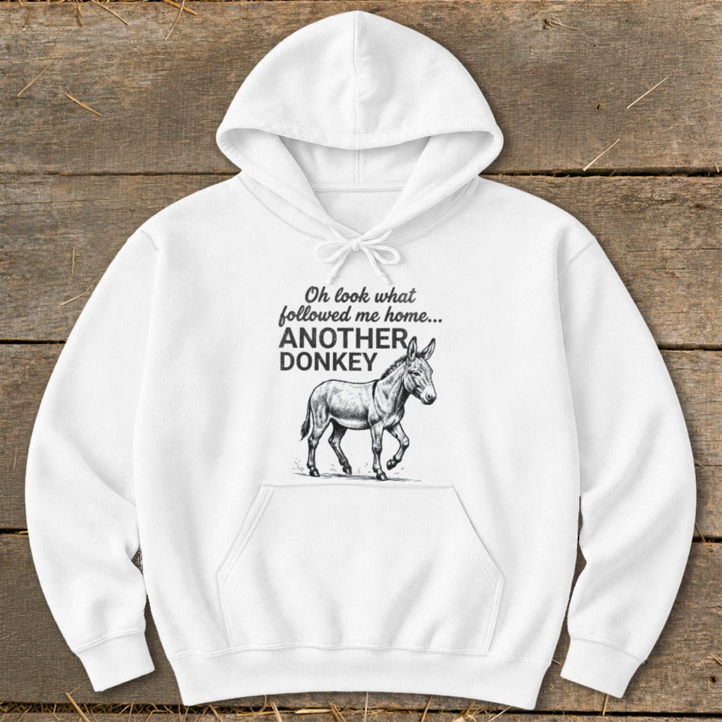 White hoodie with a sketched donkey and text that reads "Oh look what followed me home... ANOTHER DONKEY".
