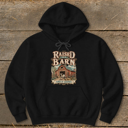 Black hoodie with "Raised in a Barn and It Shows" text and farm graphic.
