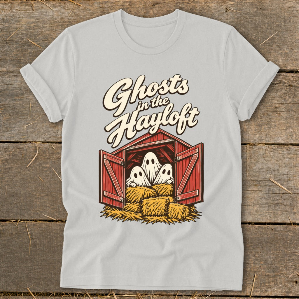 White t-shirt with "Ghosts in the Hayloft" text and cartoon ghosts in a barn.