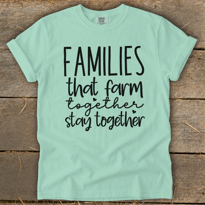 Mint t-shirt with black text "Families that farm together stay together".
