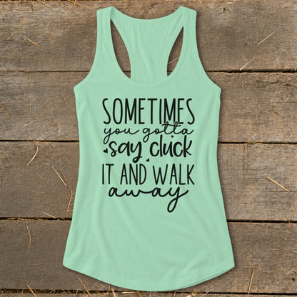 Light mint green tank top with black text reading "SOMETIMES you gotta say cluck IT AND WALK away"