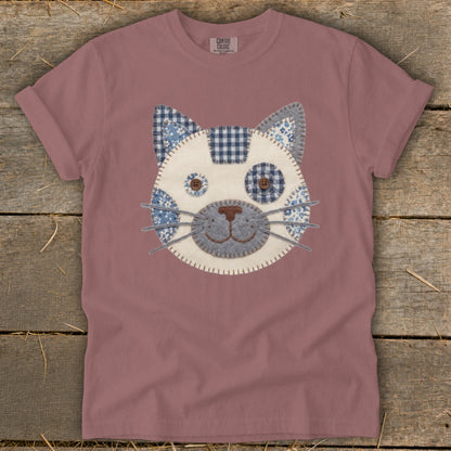 Pink t-shirt with a fabric applique cat face design.