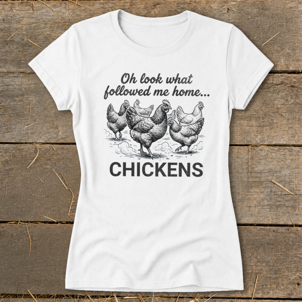 White t-shirt with drawing of chickens and text "Oh look what followed me home... CHICKENS".