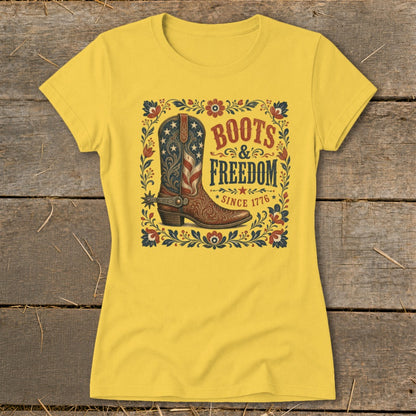 Yellow t-shirt with "Boots & Freedom Since 1776" text and American flag cowboy boot graphic.