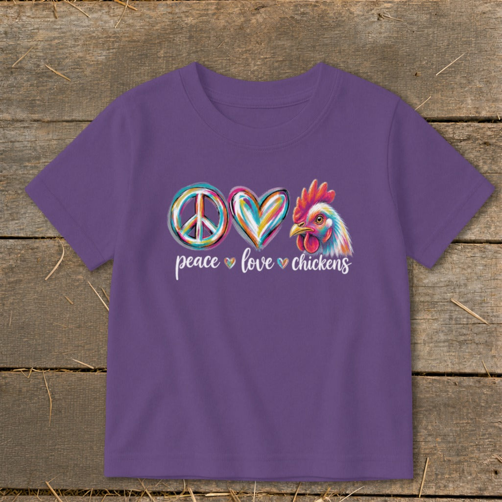 Purple t-shirt with peace, heart, and chicken graphic, text reads "peace love chickens".