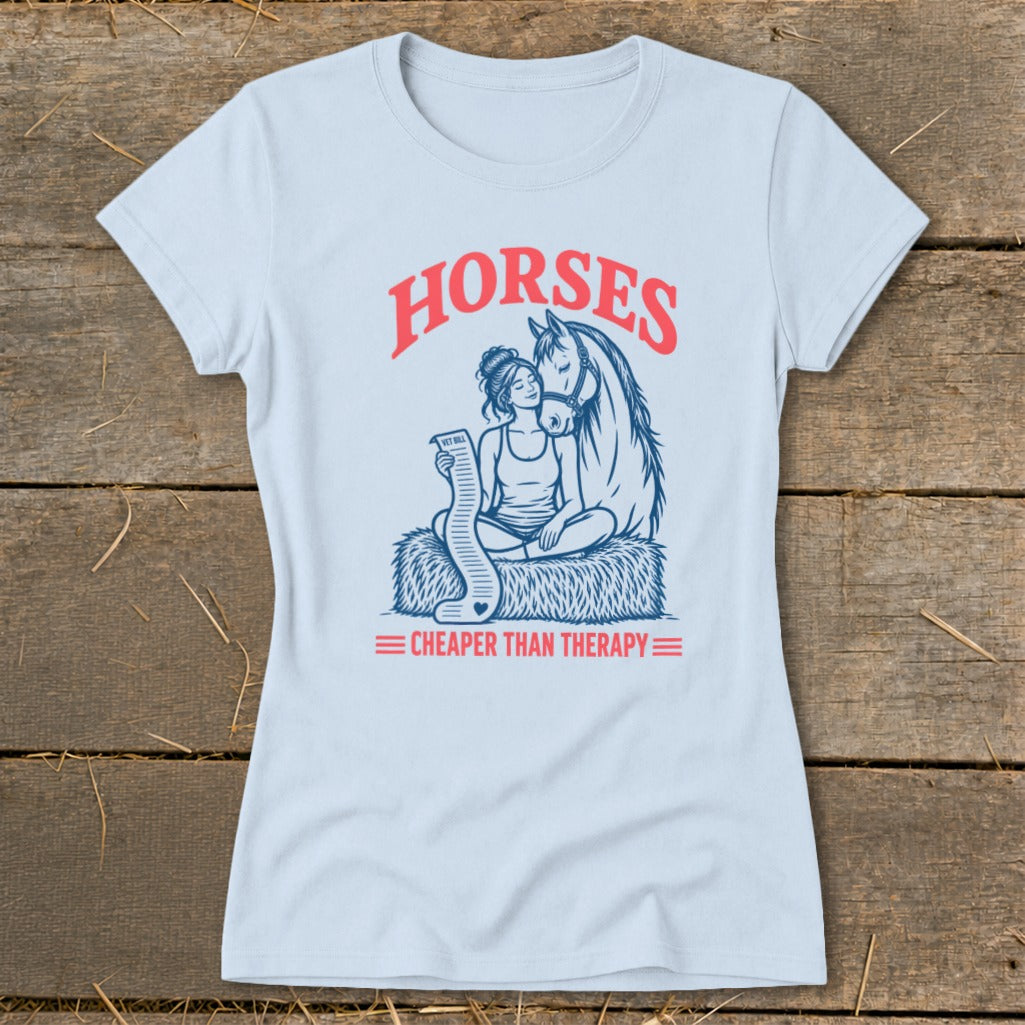 Light blue t-shirt with "HORSES CHEAPER THAN THERAPY" graphic.