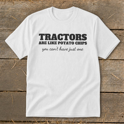 White t-shirt with black text: "TRACTORS ARE LIKE POTATO CHIPS you can't have just one."