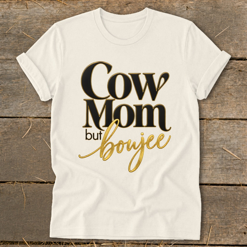 Cream t-shirt with "Cow Mom but boujee" text in black and gold.