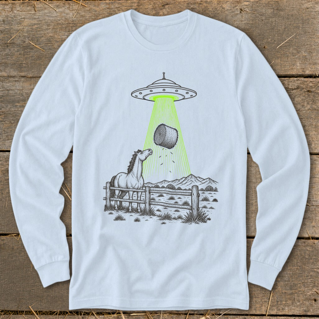 UFO abducting a hay bale over a horse in a fenced pasture.