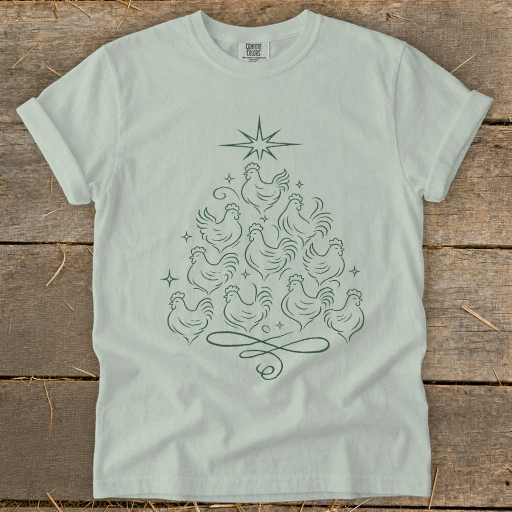 Light green t-shirt with a Christmas tree formed from line-drawn chickens and a star.