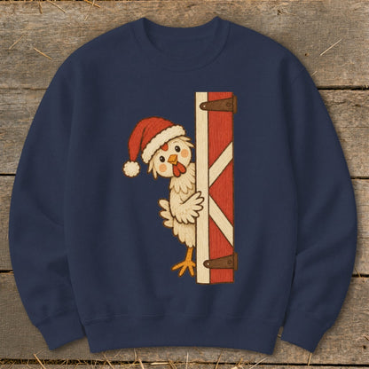 Chicken wearing a Santa hat peeking from behind a barn door.