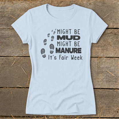 Light blue t-shirt with black text and footprints: "Might be MUD, Might be MANURE. It's Fair Week."