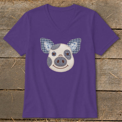Purple t-shirt with a fabric applique pig face design.