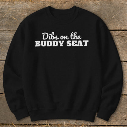 Black crewneck sweatshirt with white text "Dibs on the BUDDY SEAT".