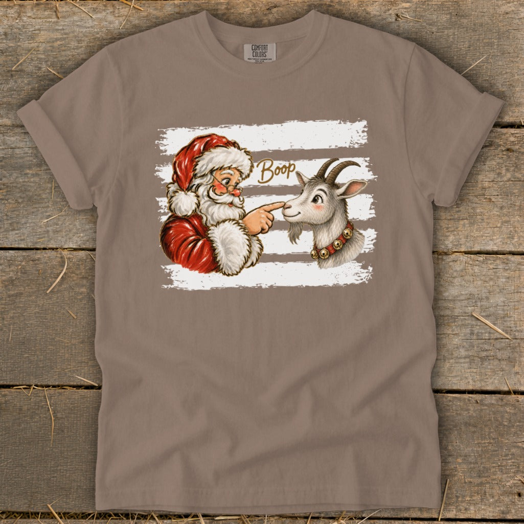 Santa boops a goat's nose with the word "Boop" written above.