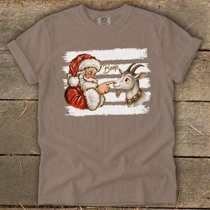 Santa boops a goat's nose with the word "Boop" written above.