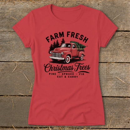 Red t-shirt with vintage red truck hauling Christmas trees, "Farm Fresh Christmas Trees" text.