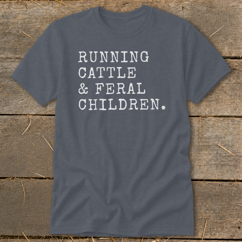 Gray t-shirt with white text reading "RUNNING CATTLE & FERAL CHILDREN."