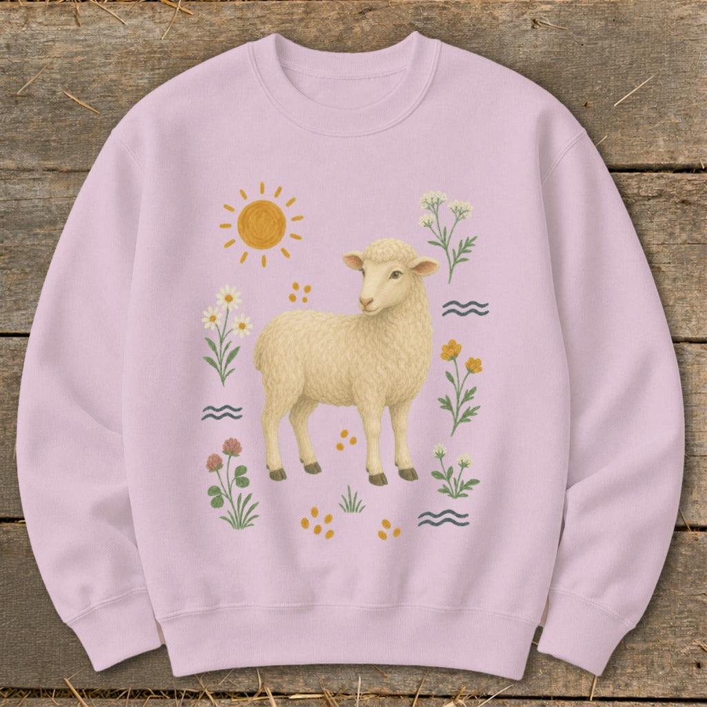 Light pink sweatshirt with a cream sheep, sun, and floral graphics.