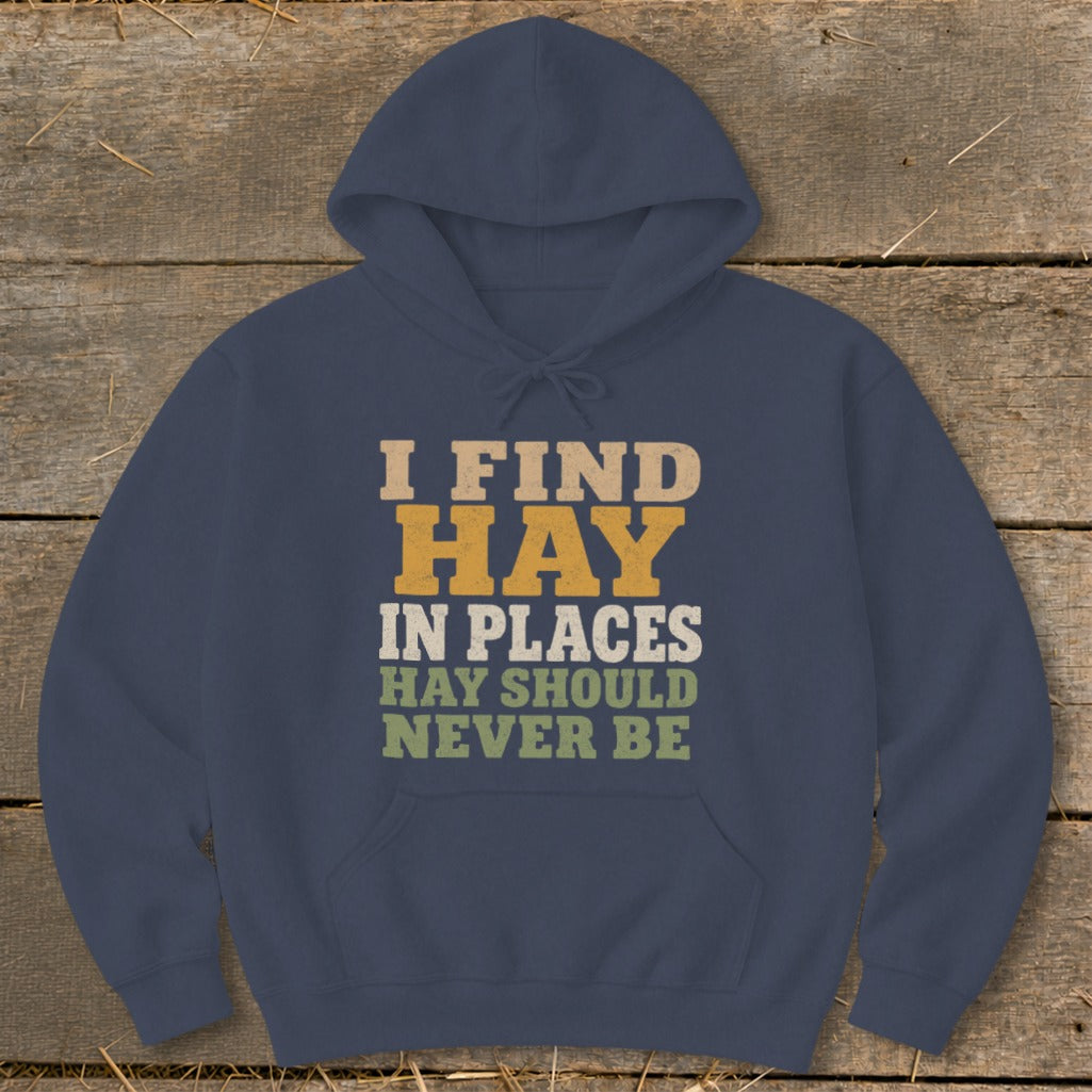 Navy hoodie with text "I FIND HAY IN PLACES HAY SHOULD NEVER BE".