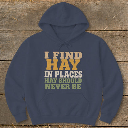 Navy hoodie with text "I FIND HAY IN PLACES HAY SHOULD NEVER BE".