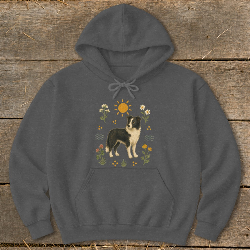 Dark gray hoodie with a graphic of a border collie in a floral sun design.