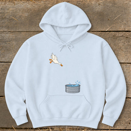 Light blue hoodie with a duck illustration jumping into a water trough.