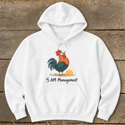 White hoodie with a cartoon rooster crowing at sunrise and text "5 AM Management".