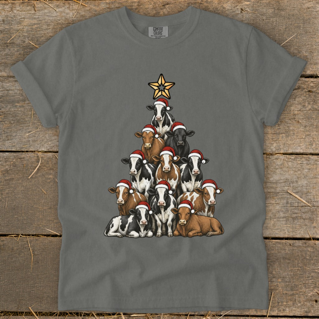T-shirt with a Christmas tree made of cows wearing Santa hats.