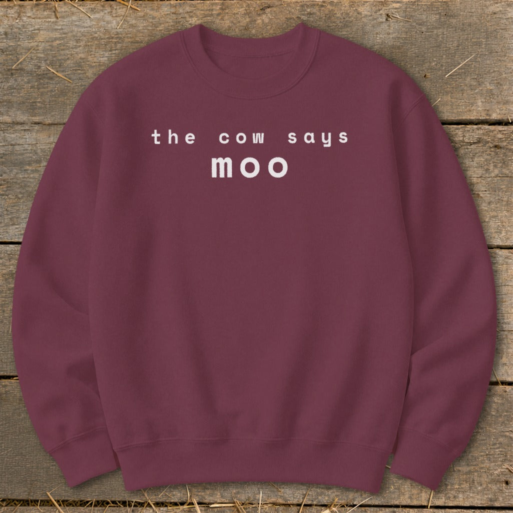 Maroon crewneck sweatshirt with white text "the cow says moo".