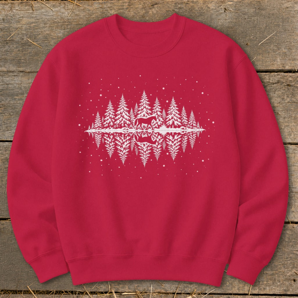 Red sweatshirt with white graphic of horses and pine trees reflecting in water.