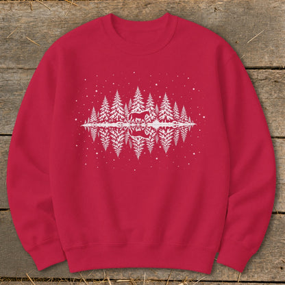 Red sweatshirt with white graphic of horses and pine trees reflecting in water.