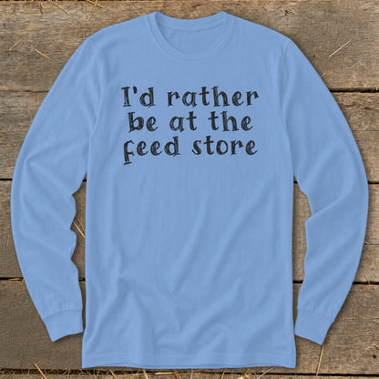 Light blue long-sleeved shirt with text "I'd rather be at the feed store."
