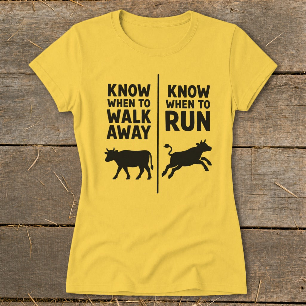 Yellow t-shirt with black text "Know When to Walk Away" and "Know When to Run" above cows.