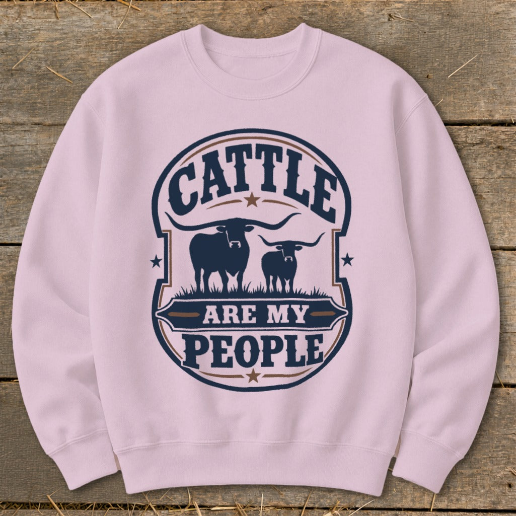 Pink sweatshirt with a circular graphic featuring two silhouetted cattle and text.