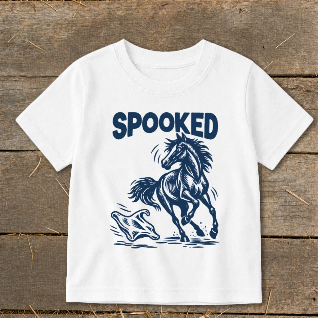 White t-shirt with "SPOOKED" text and startled horse facing a ghost.