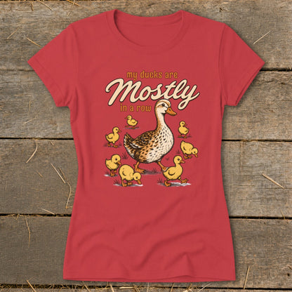 Red t-shirt with "my ducks are Mostly in a row" text and duck family illustration.