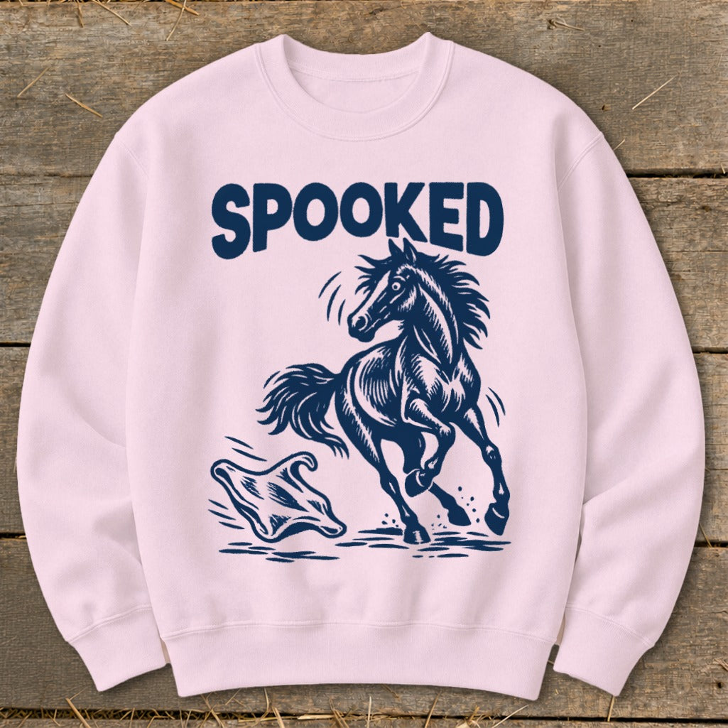 Pink sweatshirt with navy "SPOOKED" text, a startled horse, and a ghost.