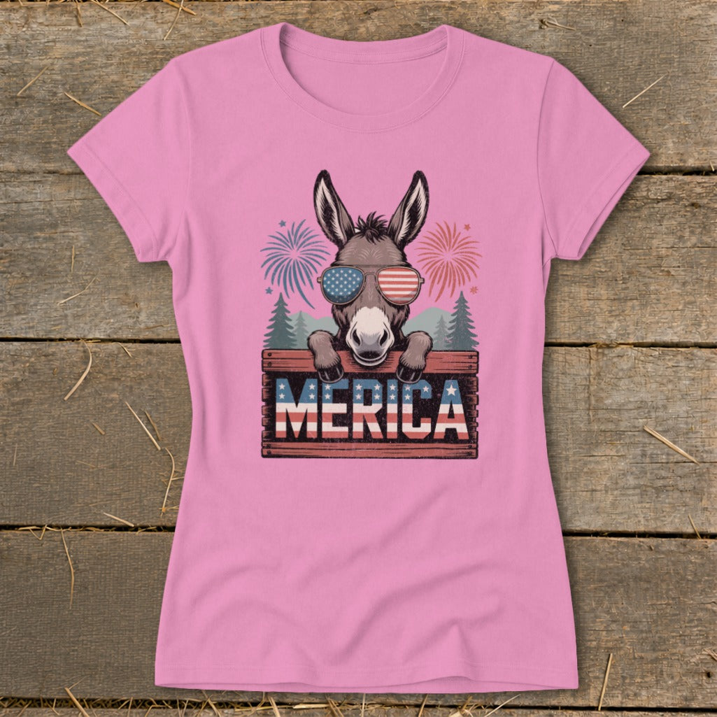 Donkey wearing patriotic sunglasses behind a "MERICA" sign with fireworks.
