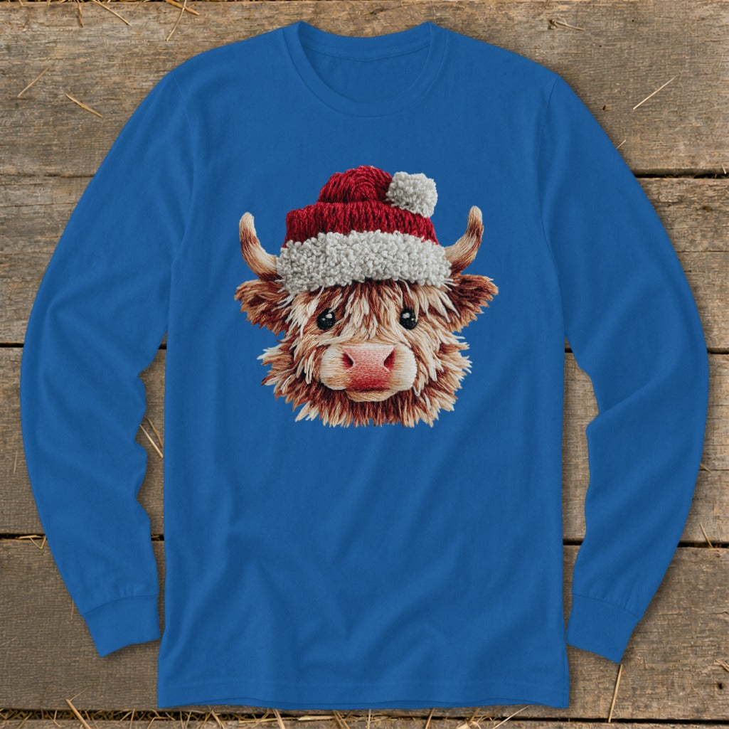 Blue long-sleeve shirt with a fluffy Highland cow wearing a Santa hat.