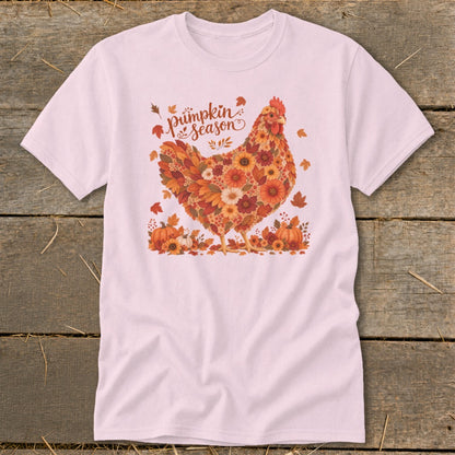 Light pink t-shirt with a chicken design made of autumn leaves and flowers, with text "pumpkin season".
