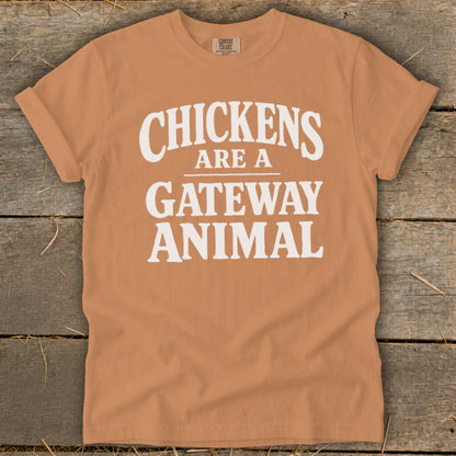 Orange t-shirt with white text that reads "Chickens Are A Gateway Animal."