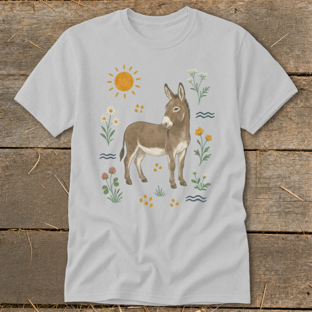 Gray t-shirt with a watercolor-style donkey surrounded by flowers, sun, and wavy lines.