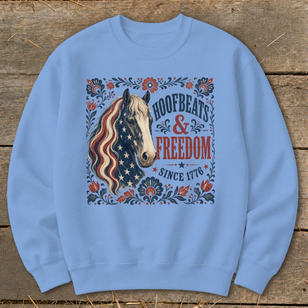 Blue sweatshirt with horse and "Hoofbeats & Freedom Since 1776" design.