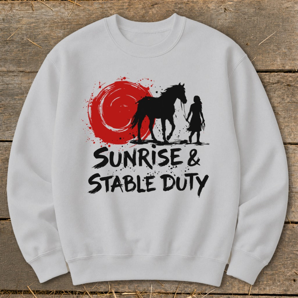 White sweatshirt with black graphic of horse and person with text "Sunrise & Stable Duty".
