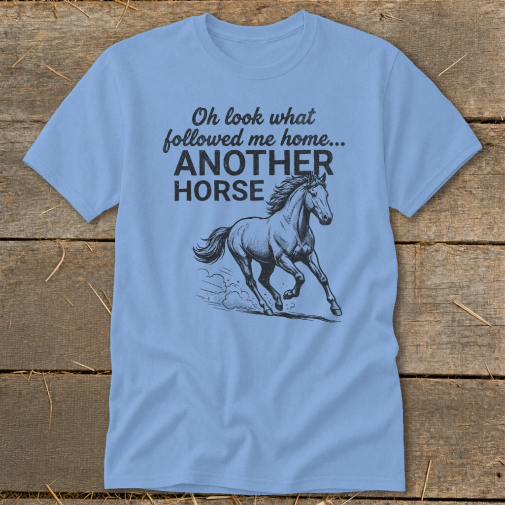 Light blue t-shirt with black text and a drawing of a galloping horse.